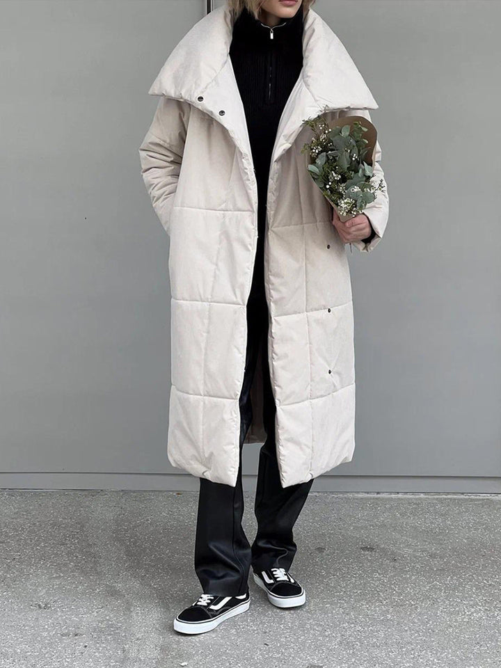 Woman in a long quilted belted coat