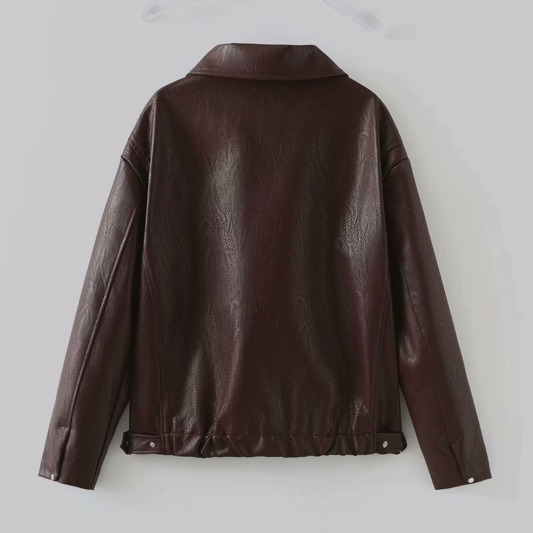 Woman in a cropped burgundy leather jacket