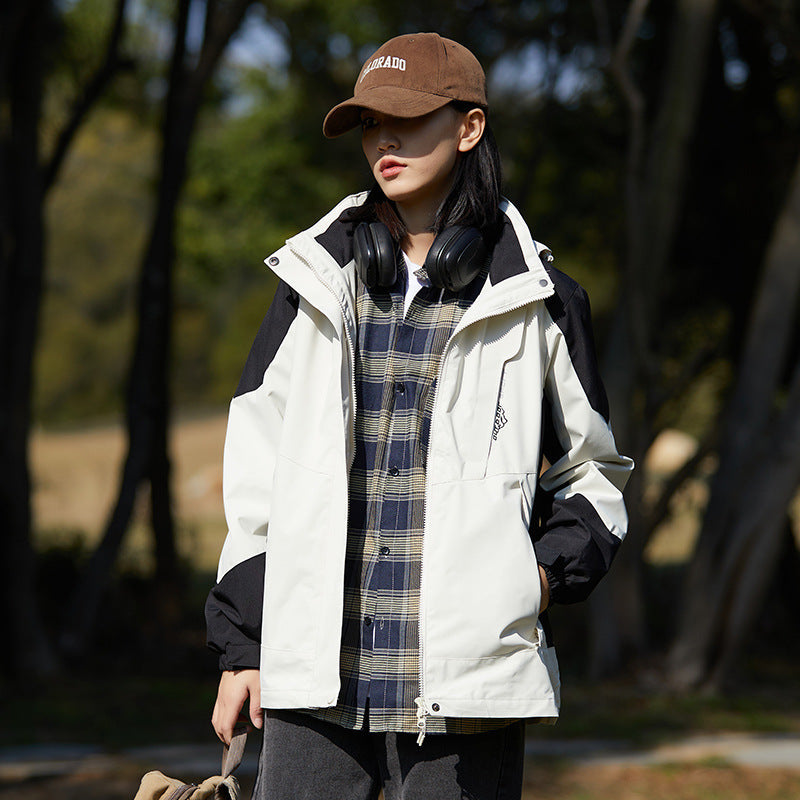 Women two-layer water-repellent outdoor jacket with hood, waist adjustment and contrast piping