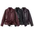 Women's short jacket made of faux leather with a belted waist and shirt collar