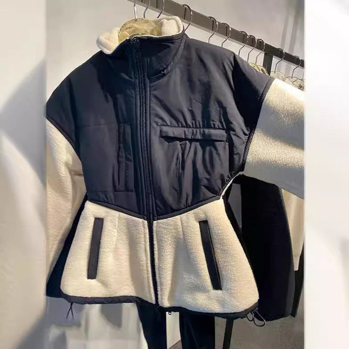 Ladies hybrid fleece jacket with padded top, stand-up collar and tailored peplum