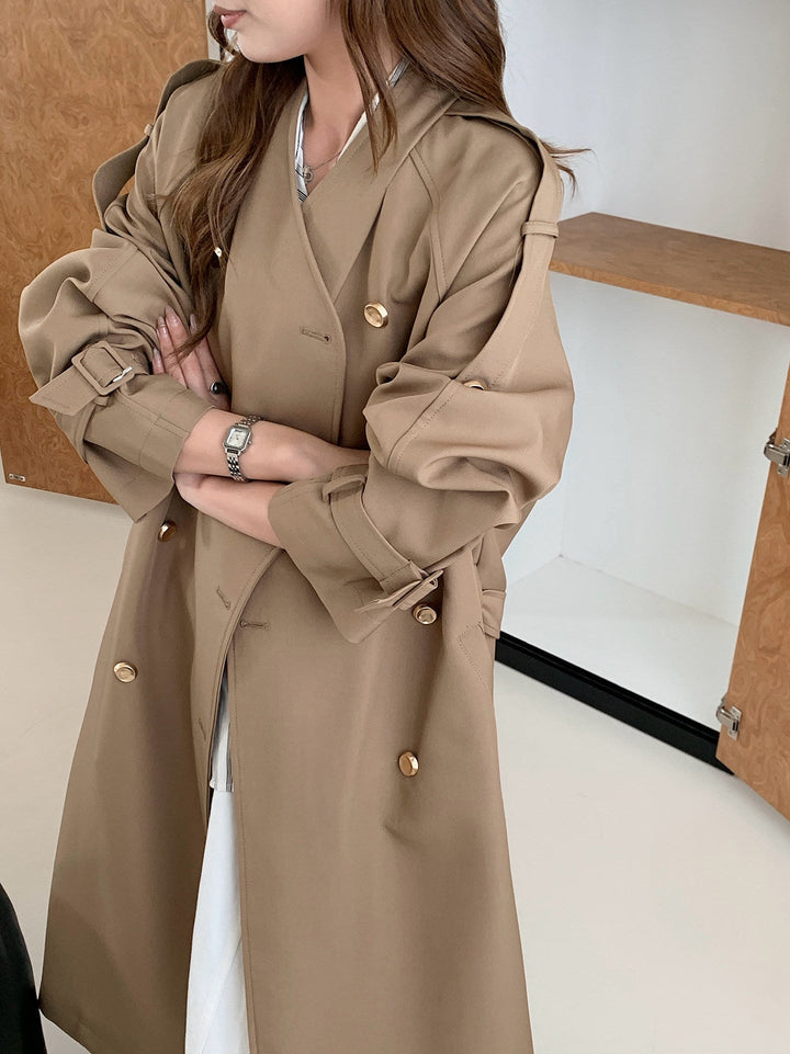 Women Long Cut Trench Coat with Double-Breasted Button Placket and Adjustable Sleeve Straps