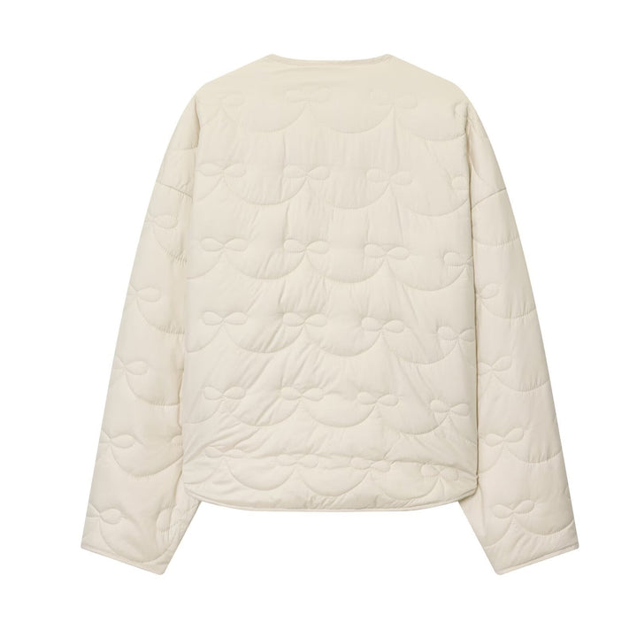 Women’s quilted jacket without collar with decorative bow quilting and snap button closure
