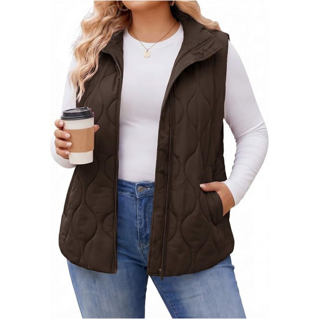 Ladies quilted vest with high collar, figure-flattering silhouette and side pockets