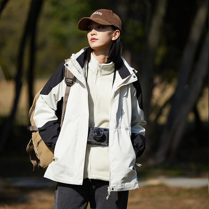 Women two-layer water-repellent outdoor jacket with hood, waist adjustment and contrast piping
