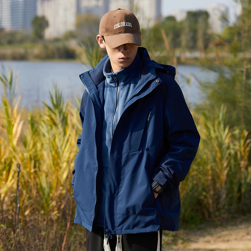 Women two-layer water-repellent outdoor jacket with hood, waist adjustment and contrast piping