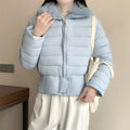Women's short padded waist jacket with removable faux fur collar and reinforced hem