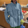 Women's cropped parka with high stand collar, drawstring, and multiple pockets