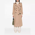 Women's trench coat in maxi length with double-breasted button placket and waist belt