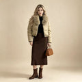 Women's short tailored puffer jacket with voluminous hood collar and detachable fur trim