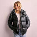 Women's quilted puffer jacket with hood, high stand-up collar, and two-way zip
