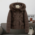 Women's short quilted hooded jacket with voluminous faux fur trim, drawstring waist, and flap pockets