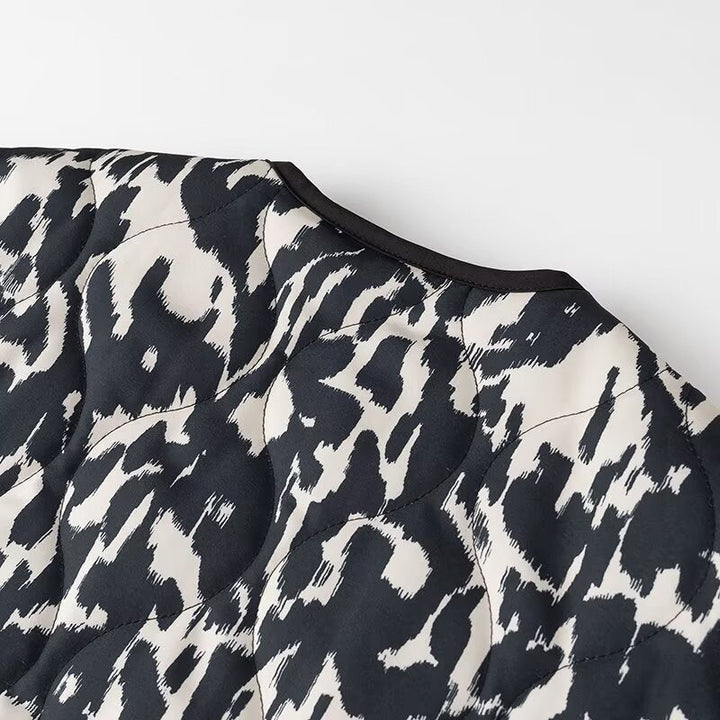 Women’s quilted jacket in oversized boxy cut with round neckline and abstract animal print
