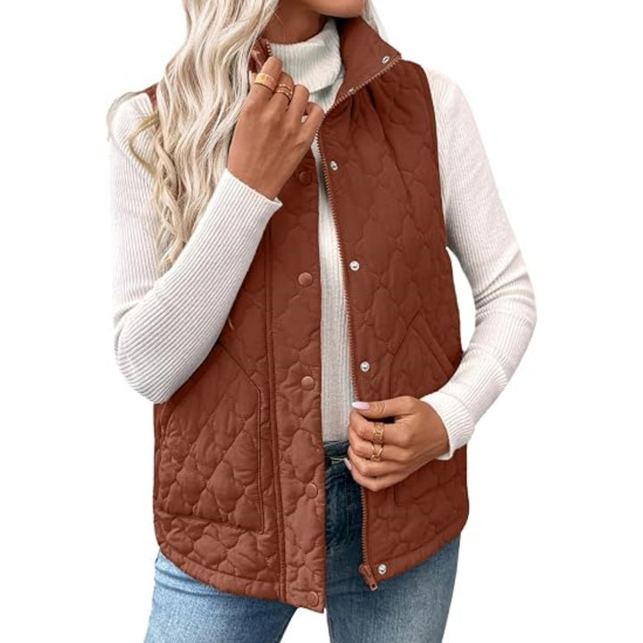 Women’s quilted vest with high standing collar, double closure and curved hem