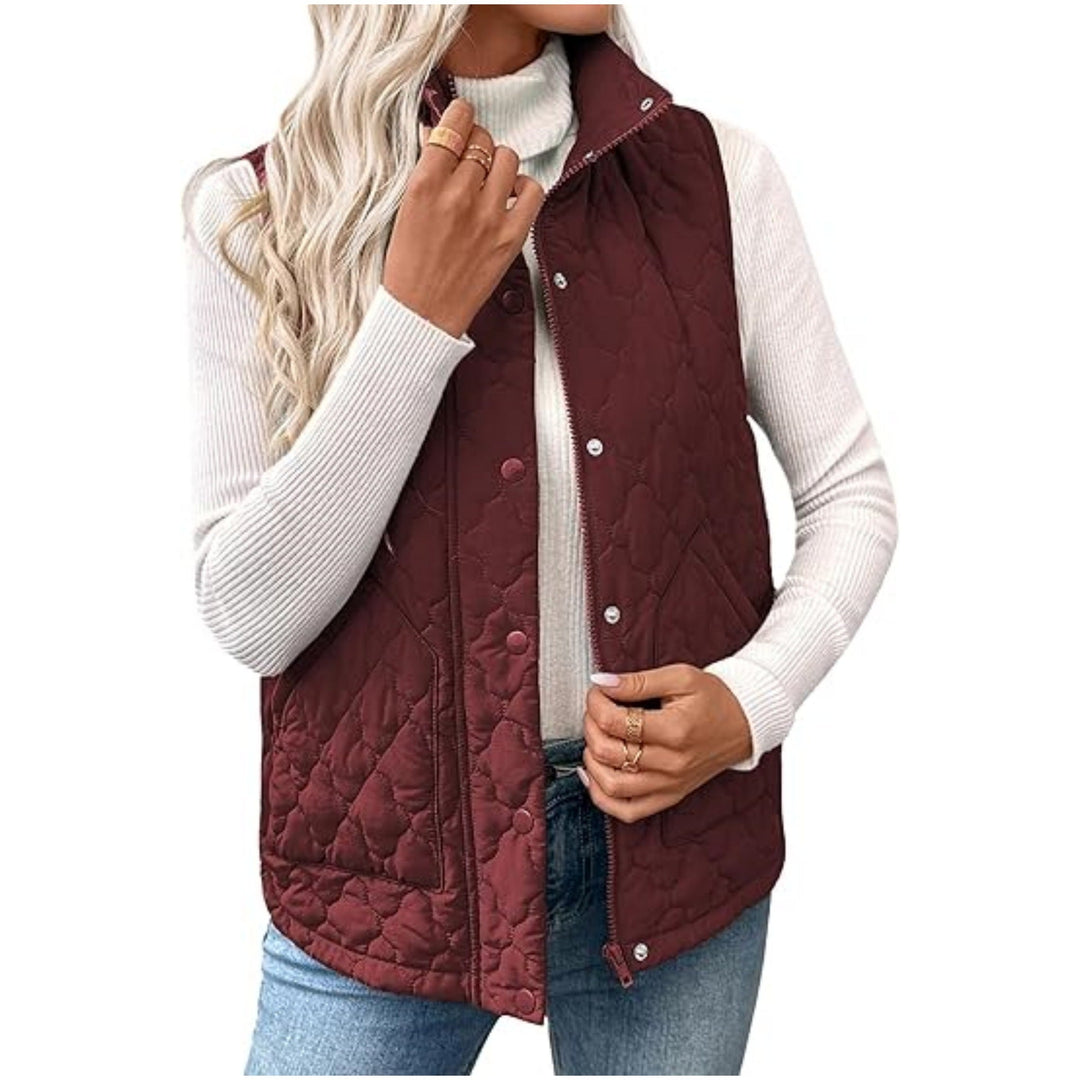 Women’s quilted vest with high standing collar, double closure and curved hem