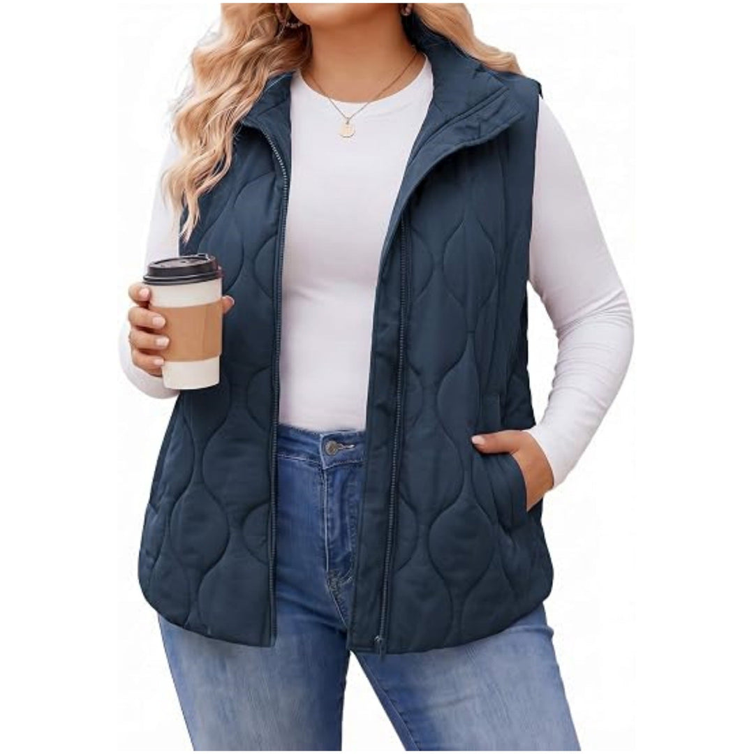 Ladies quilted vest with high collar, figure-flattering silhouette and side pockets