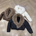 Women's short cut boxy puffer jacket with extra large faux fur collar and shape-stable hem