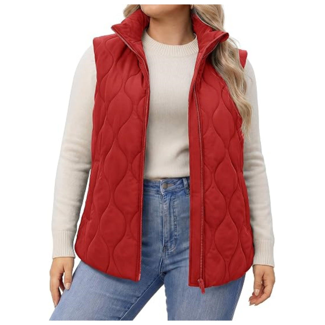 Ladies quilted vest with high collar, figure-flattering silhouette and side pockets