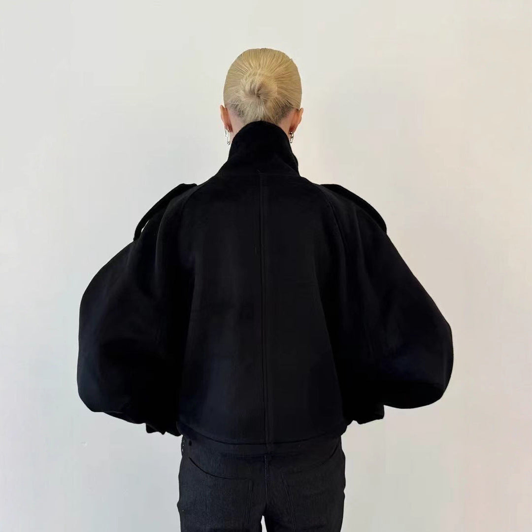 Ladies short cut oversized wool jacket with high stand-up collar, shoulder flaps and adjustable sleeve straps