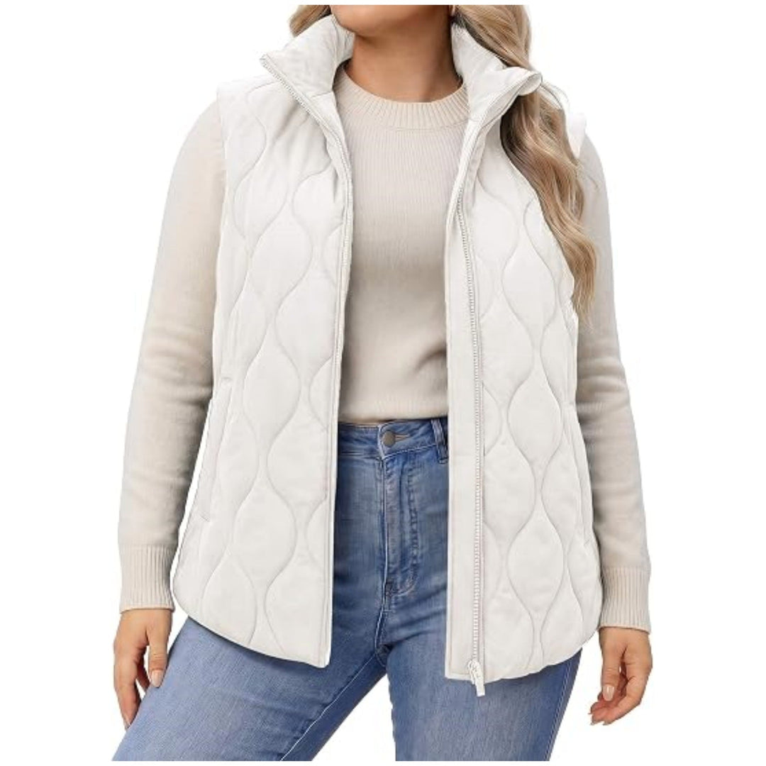 Ladies quilted vest with high collar, figure-flattering silhouette and side pockets
