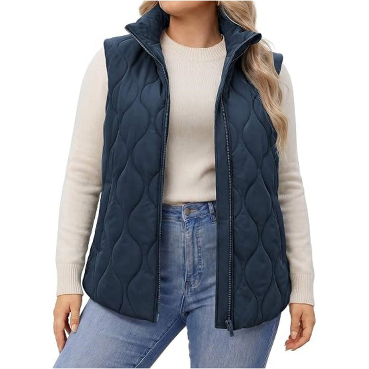 Ladies quilted vest with high collar, figure-flattering silhouette and side pockets