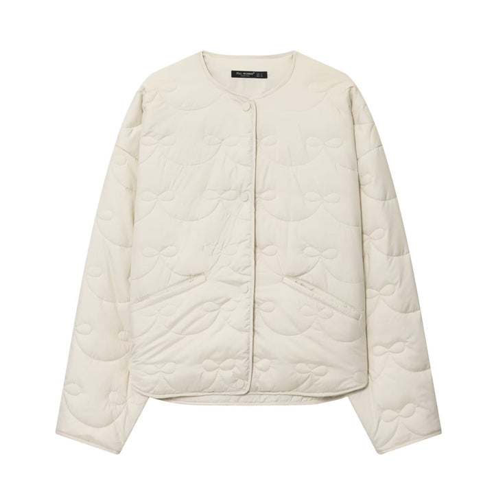 Women’s quilted jacket without collar with decorative bow quilting and snap button closure