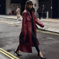 Women's Long Faux Leather Trench Coat with Waist Belt, Wide Lapels and Water-Resistant Surface