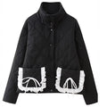 Women’s quilted jacket with stand-up collar and contrasting ruffled pockets
