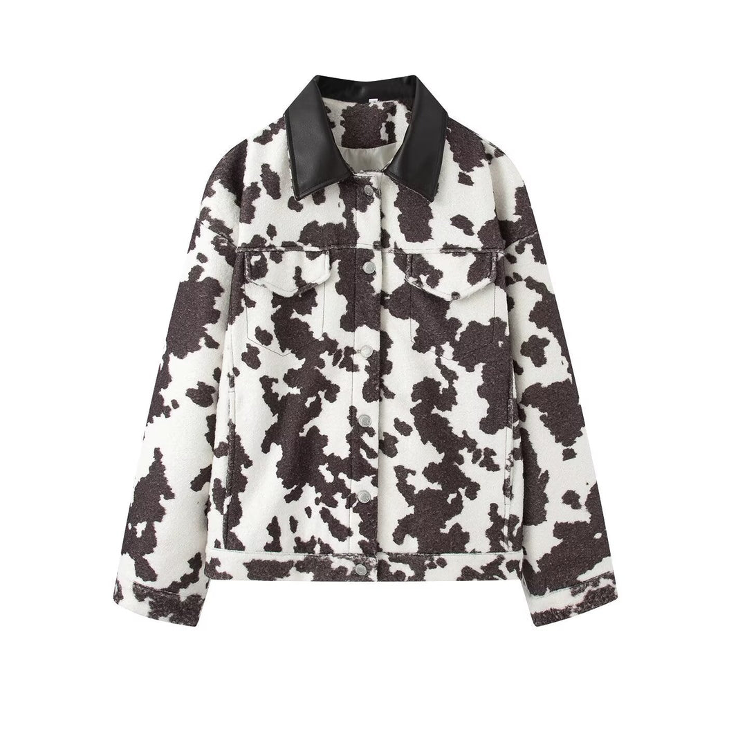 Women’s teddy trucker jacket with cow spot pattern and faux leather collar