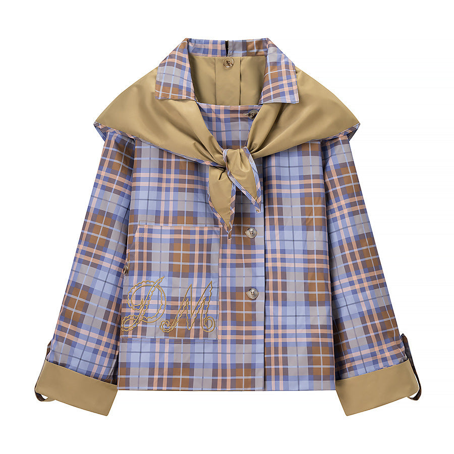 Women’s short jacket with check collar, tie scarf, and monogram pocket