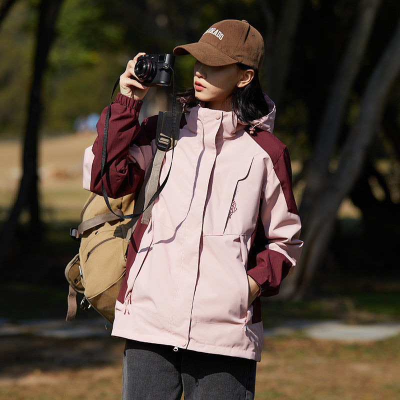 Women two-layer water-repellent outdoor jacket with hood, waist adjustment and contrast piping