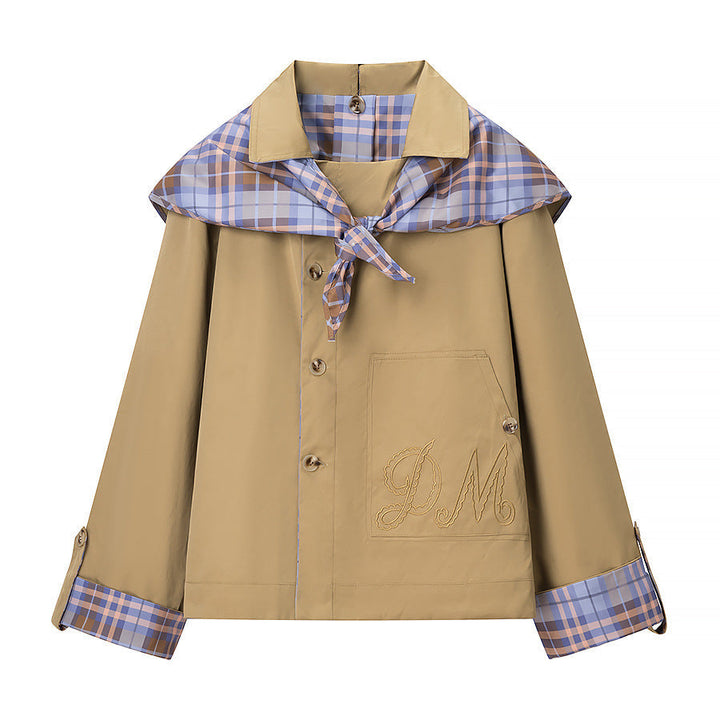 Women’s short jacket with check collar, tie scarf, and monogram pocket