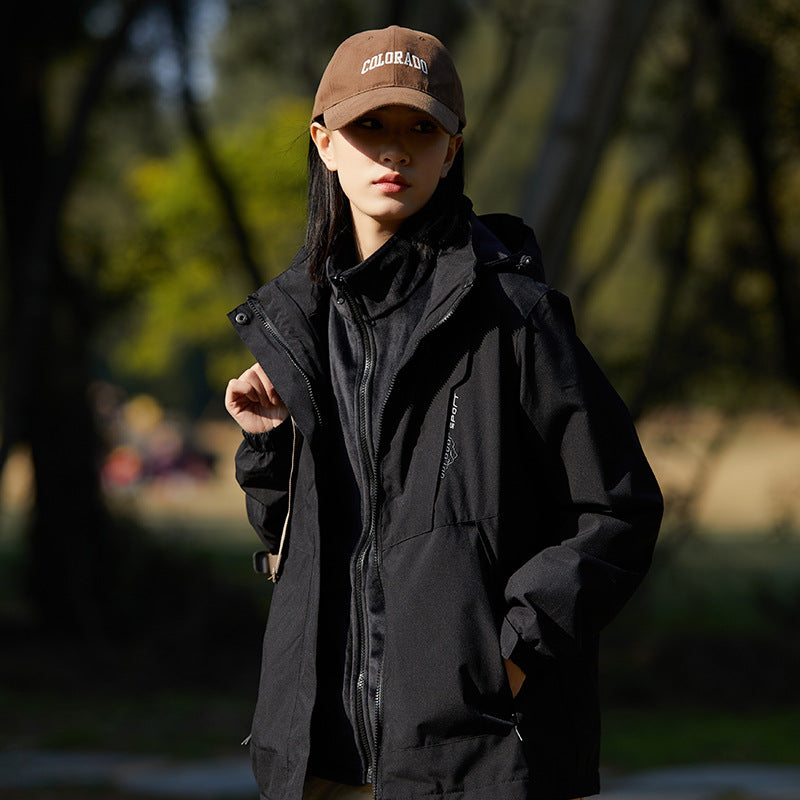 Women two-layer water-repellent outdoor jacket with hood, waist adjustment and contrast piping