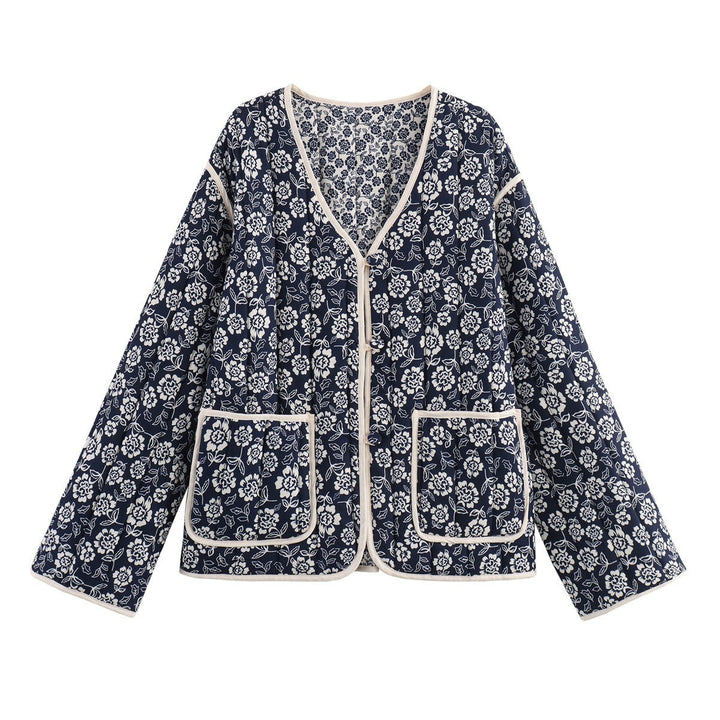 Ladies quilted jacket with floral allover, V-neck, contrast piping and patch pockets