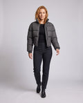Women's short fitted quilted jacket with high stand-up collar and corset look